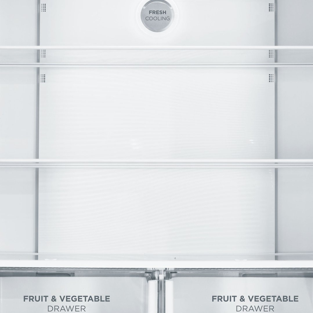 Interior view of a French door fridge with shelves and fruit & vegetable drawers