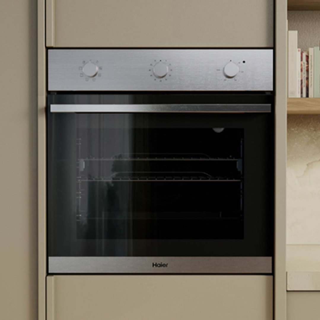 Built-in oven with stainless steel controls and black glass door in a kitchen setting
