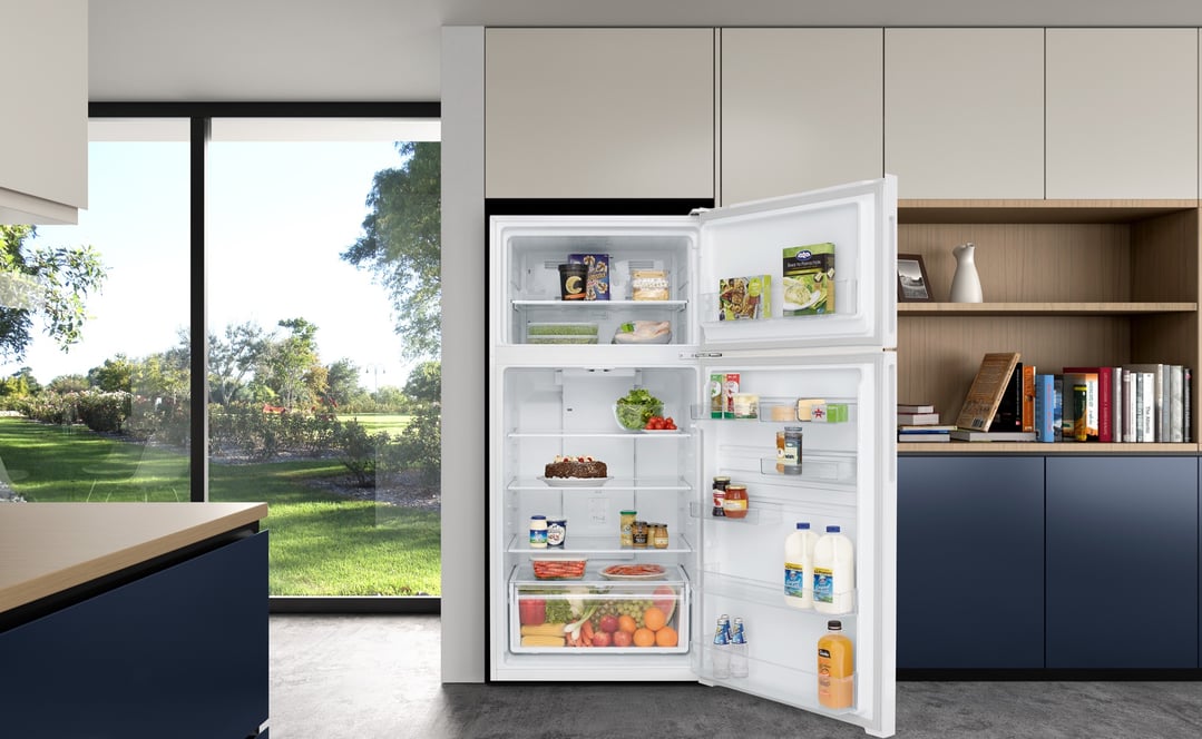 Open top mount fridge in a modern kitchen with a garden view