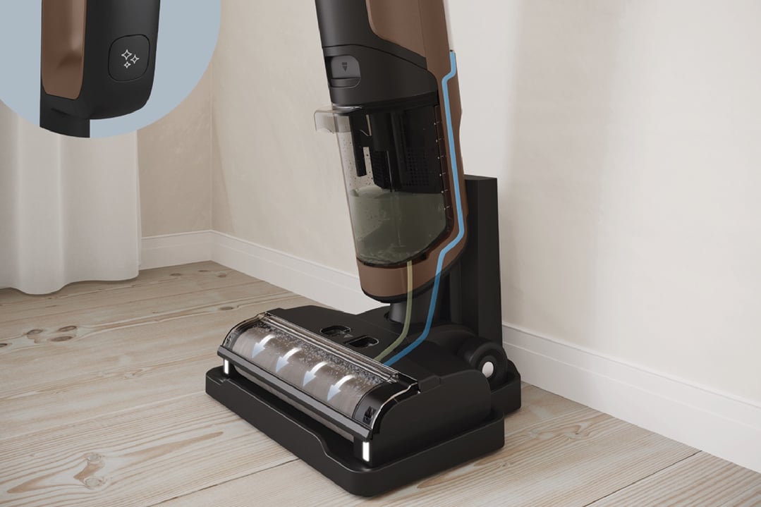 Electrolux UltimateHome 700 Wet & Dry Vacuum charging on its stand on a wooden floor