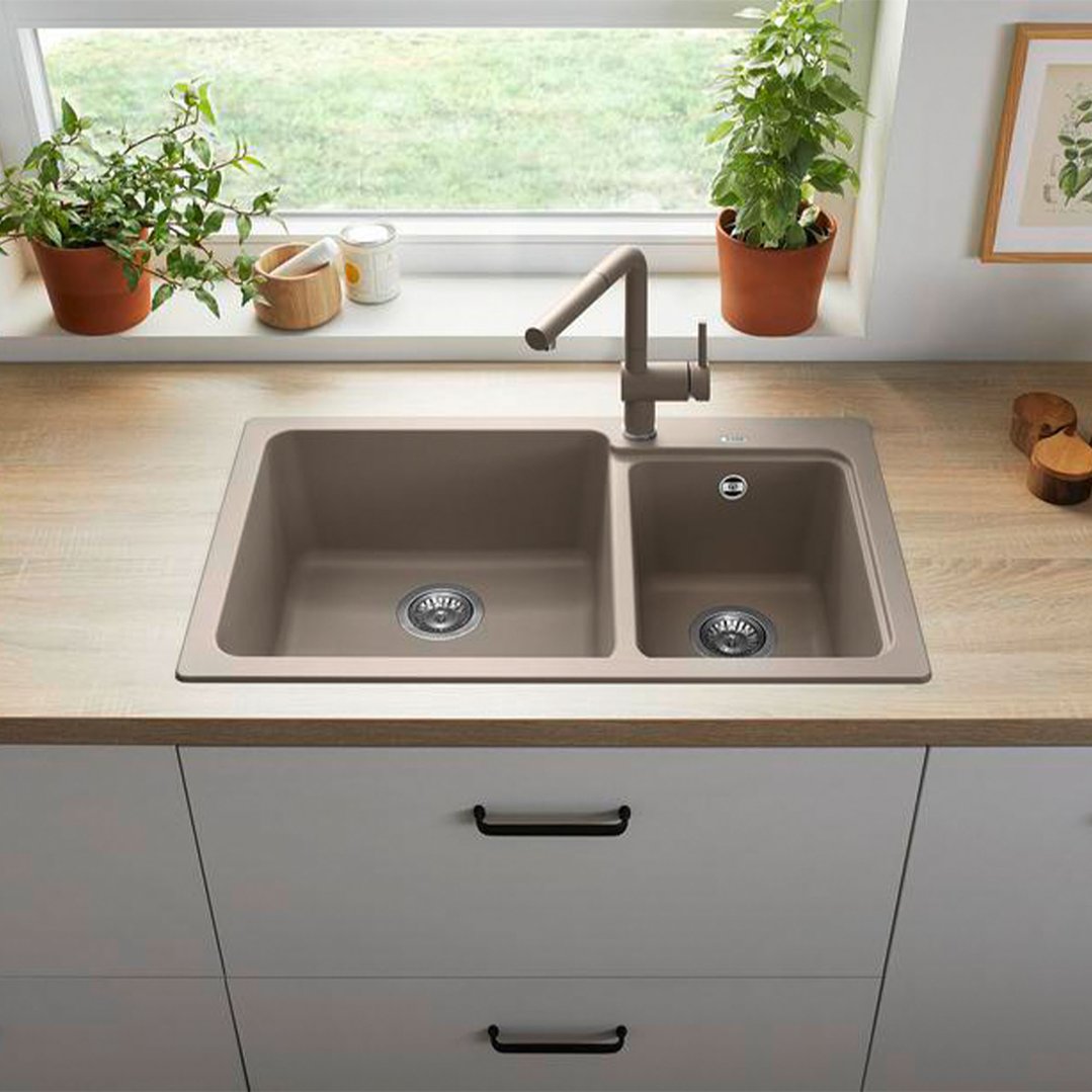 BLANCO Elegant 1 1/2 bowl sink in a kitchen with plants and window