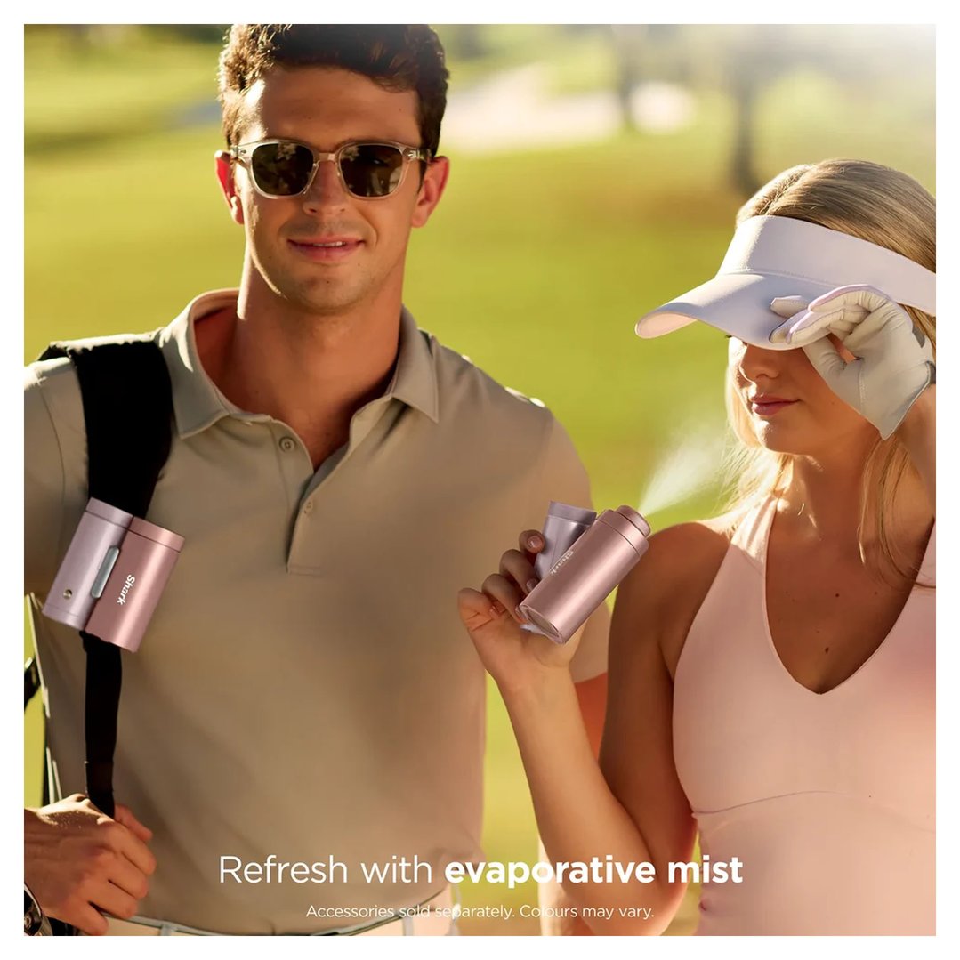 Man and woman walking outdoors, woman using a SHARK CHILLPILL misting device