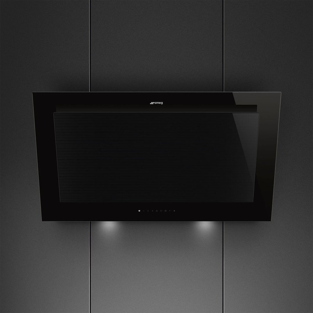Black rangehood with lights on, mounted on a dark textured wall