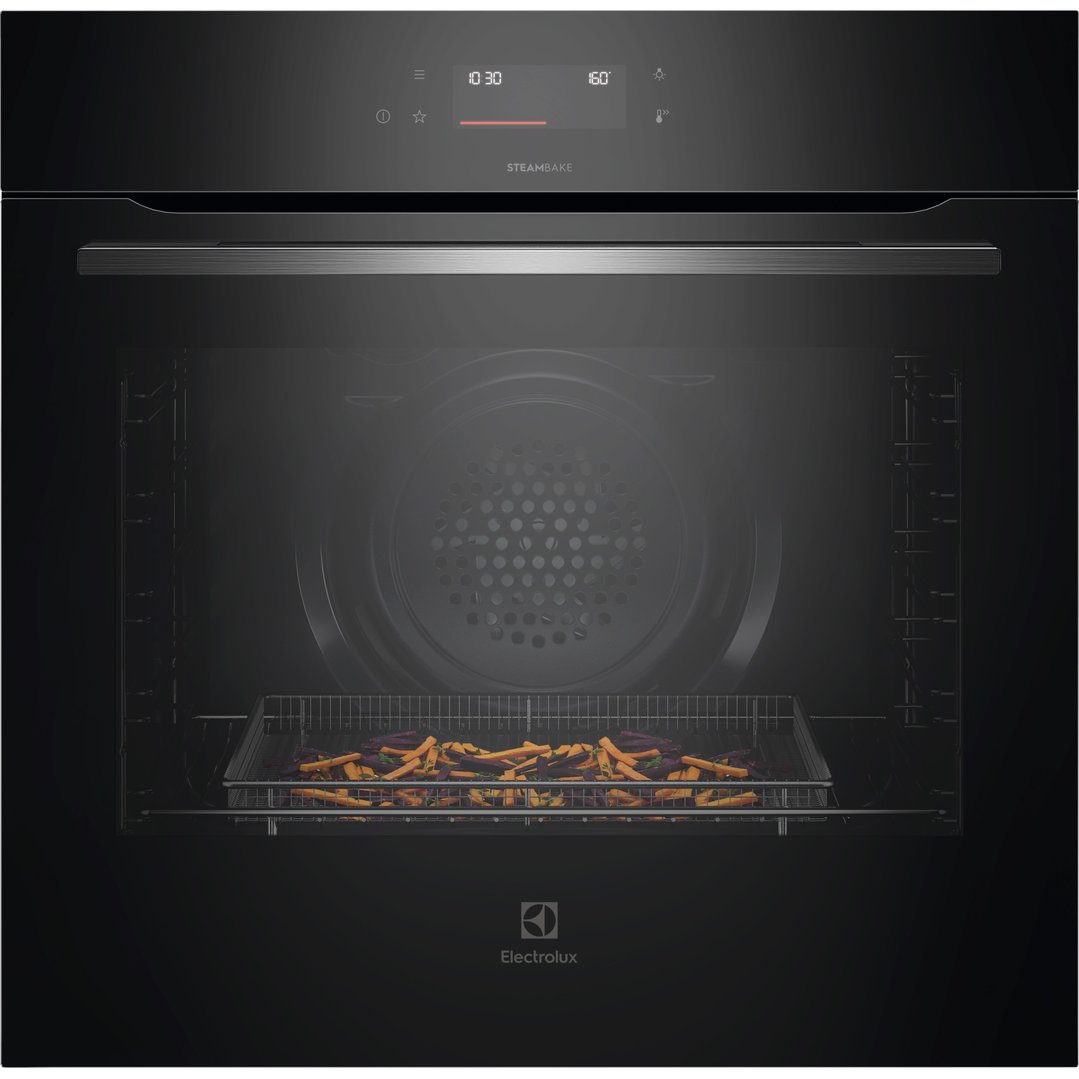 Black Electrolux oven with sweet potato fries cooking inside