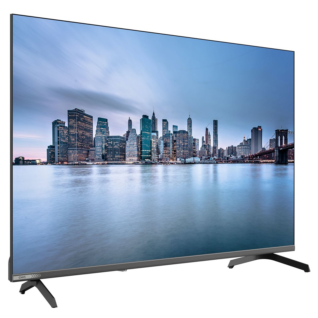 A CHIQ TV displaying a cityscape at dusk, on a white background