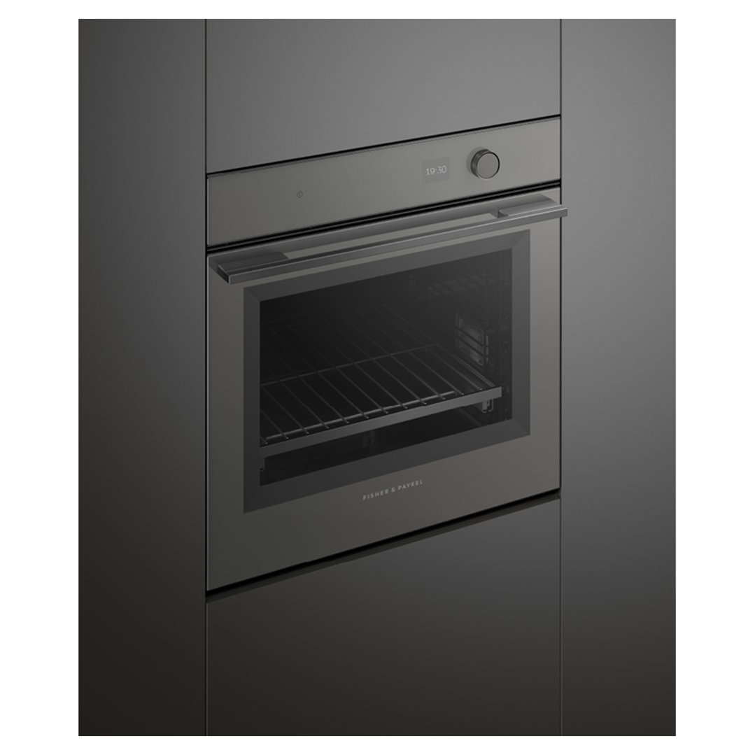 Dark grey built-in oven with a digital display showing 19:30 in a kitchen