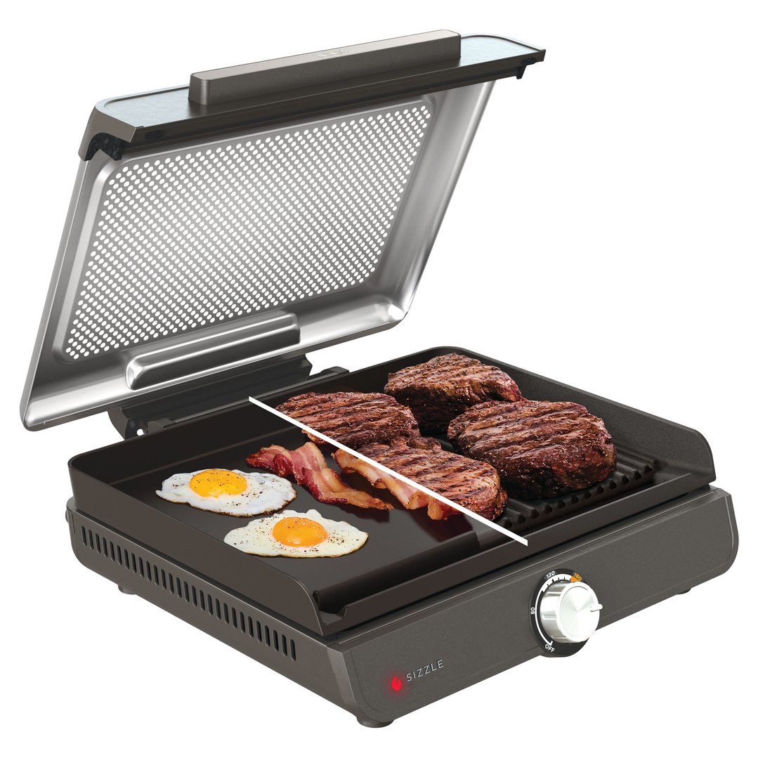 Ninja Sizzle Indoor Grill and Flat Plate cooking steaks, bacon, and eggs