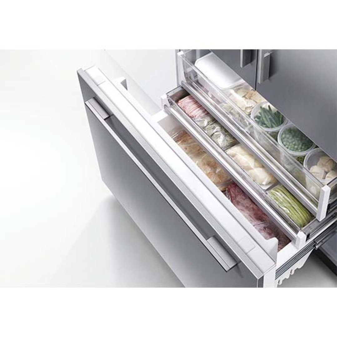 Open freezer drawers of a refrigerator freezer filled with various foods