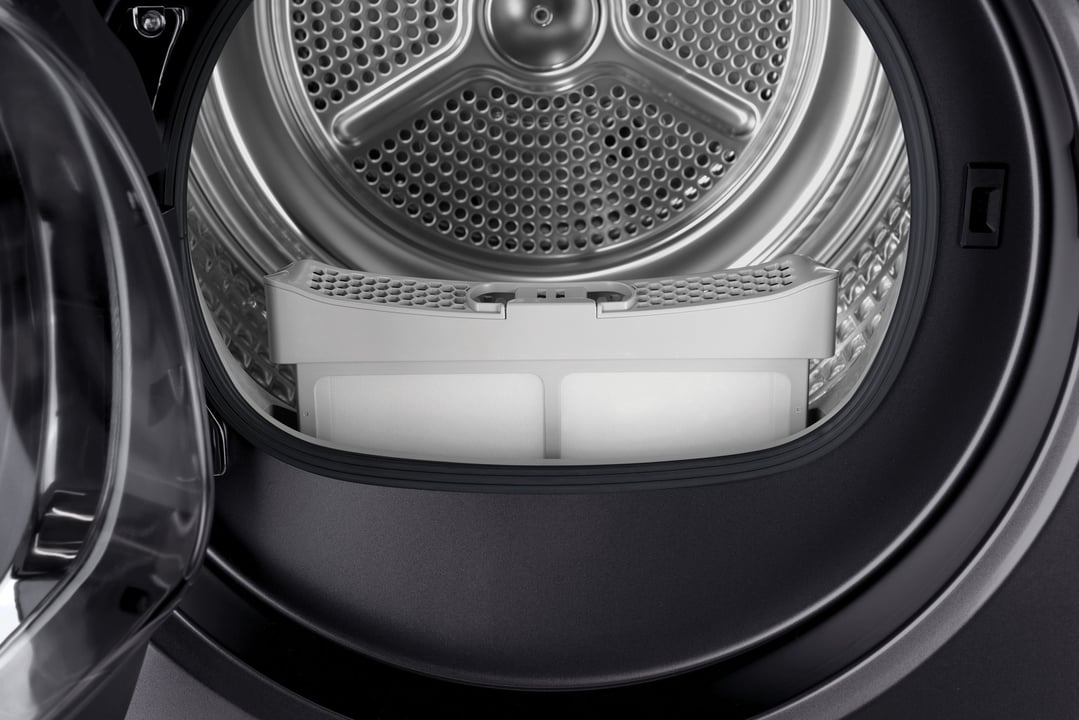 Close up of the open door and interior drum of a washer dryer combo