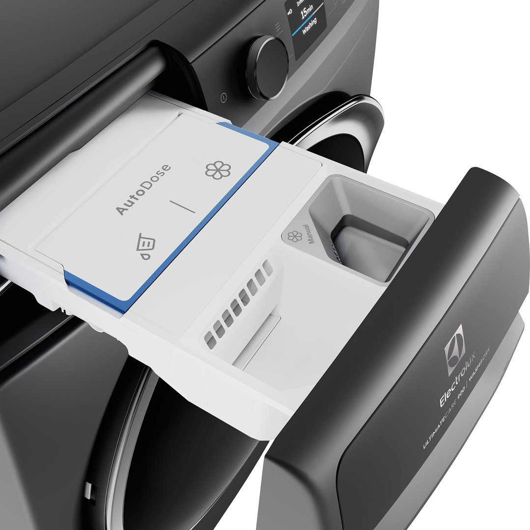 Close-up of the open detergent dispenser drawer of a dark onyx washing machine