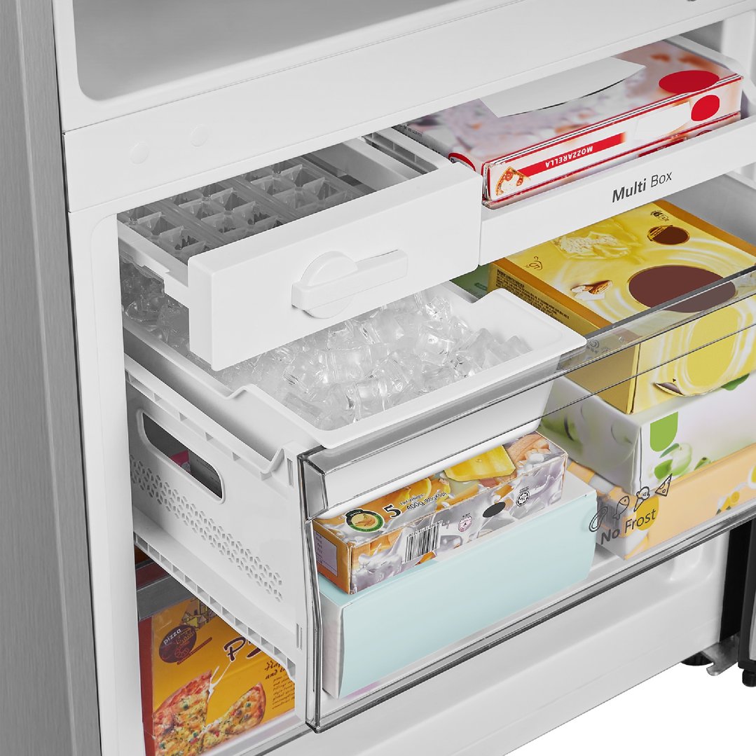 Close-up of the freezer compartment of a Hisense fridge, showing ice and frozen food