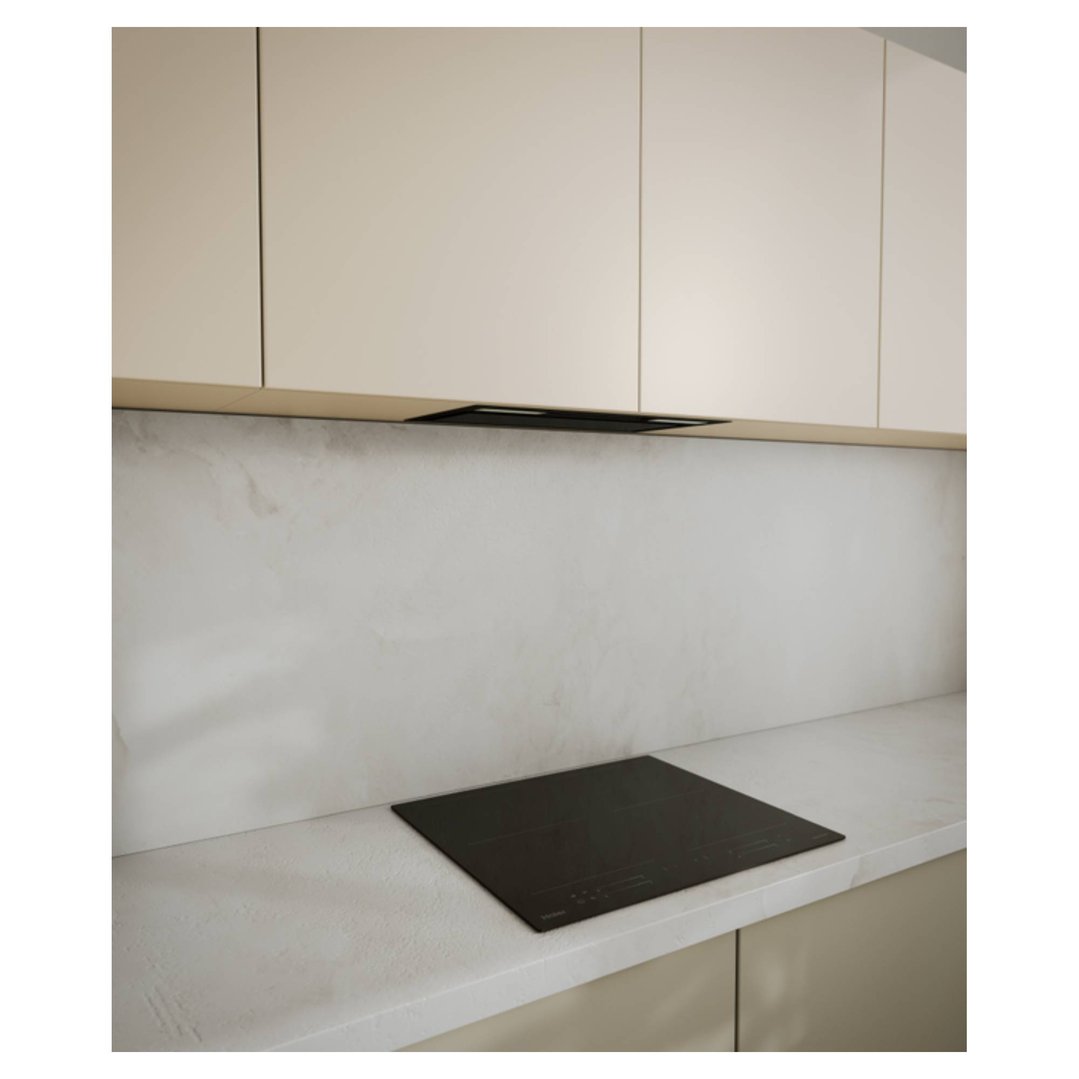 Integrated rangehood and cooktop in a modern kitchen with light cabinetry