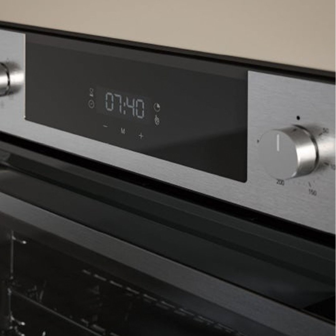 Close up of a built-in oven control panel with digital display