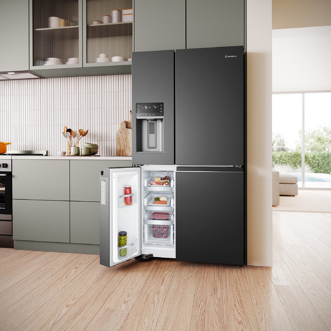 Matte black quad door fridge with open freezer drawer in a modern kitchen