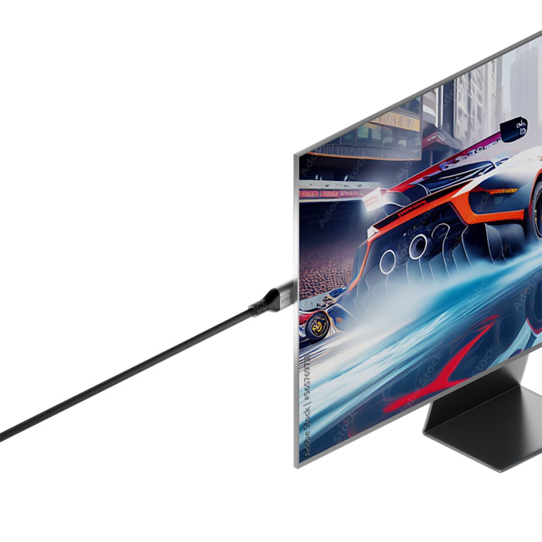 HDMI cable connecting to a monitor displaying a racing car game