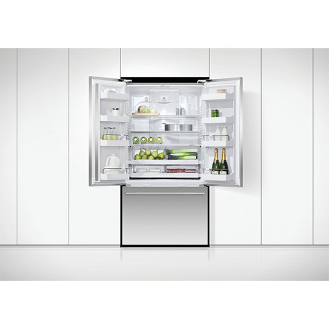 French door refrigerator freezer with doors open, filled with food and drinks