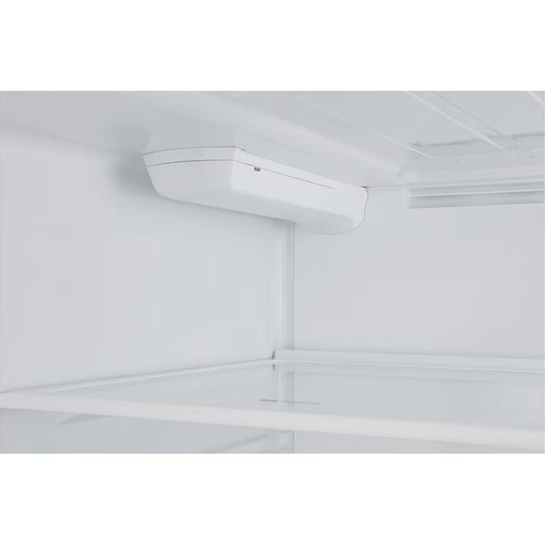 Interior view of a fridge freezer showing the water filter housing