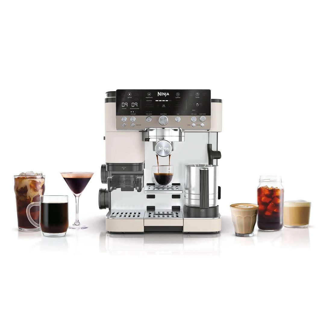 Ninja Luxe Café Premier Espresso Machine brewing coffee with various coffee drinks around it
