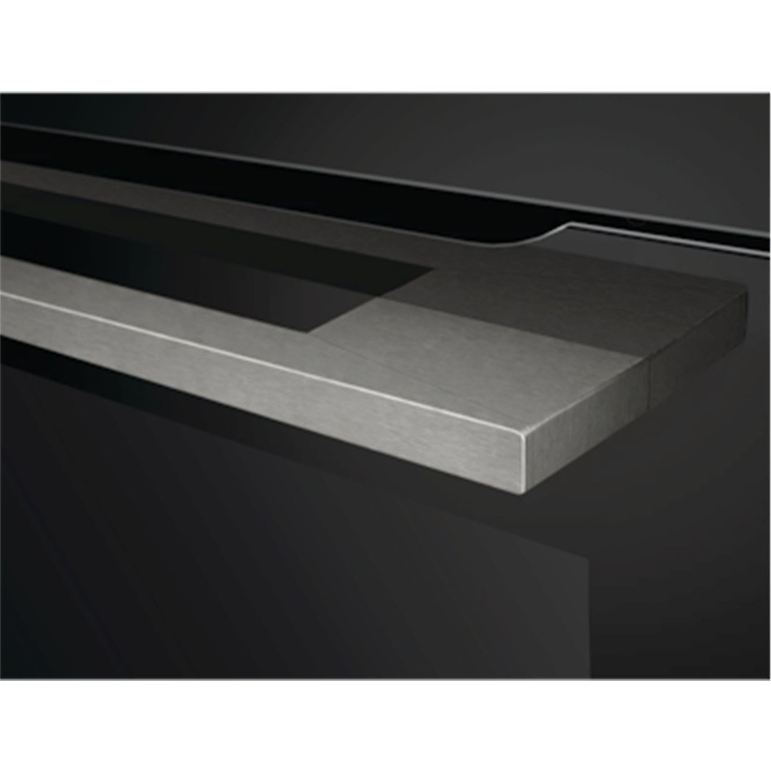 Close-up of the oven handle and part of the black oven door