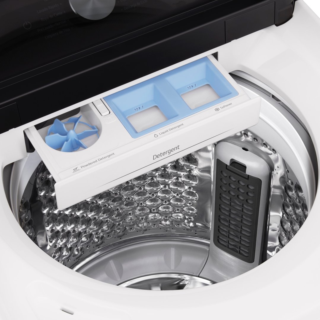 Close-up of the open top-load washing machine with detergent dispenser drawer