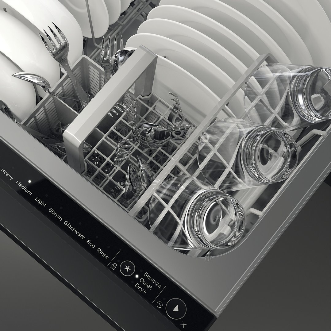 Close-up of a dishwasher drawer filled with white dishes, cutlery, and glasses