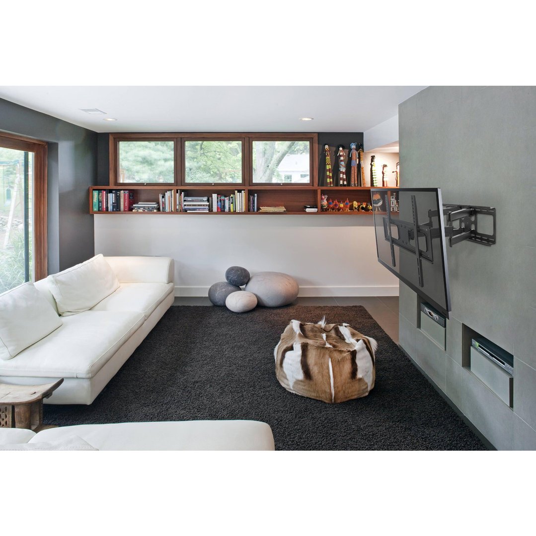 A Tilt and Turn TV Wall Mount holding a TV in a modern living room