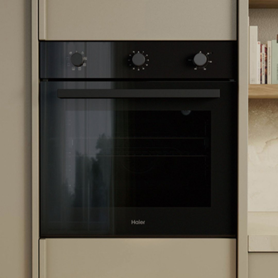 Built-in Haier oven with three control knobs in a kitchen setting