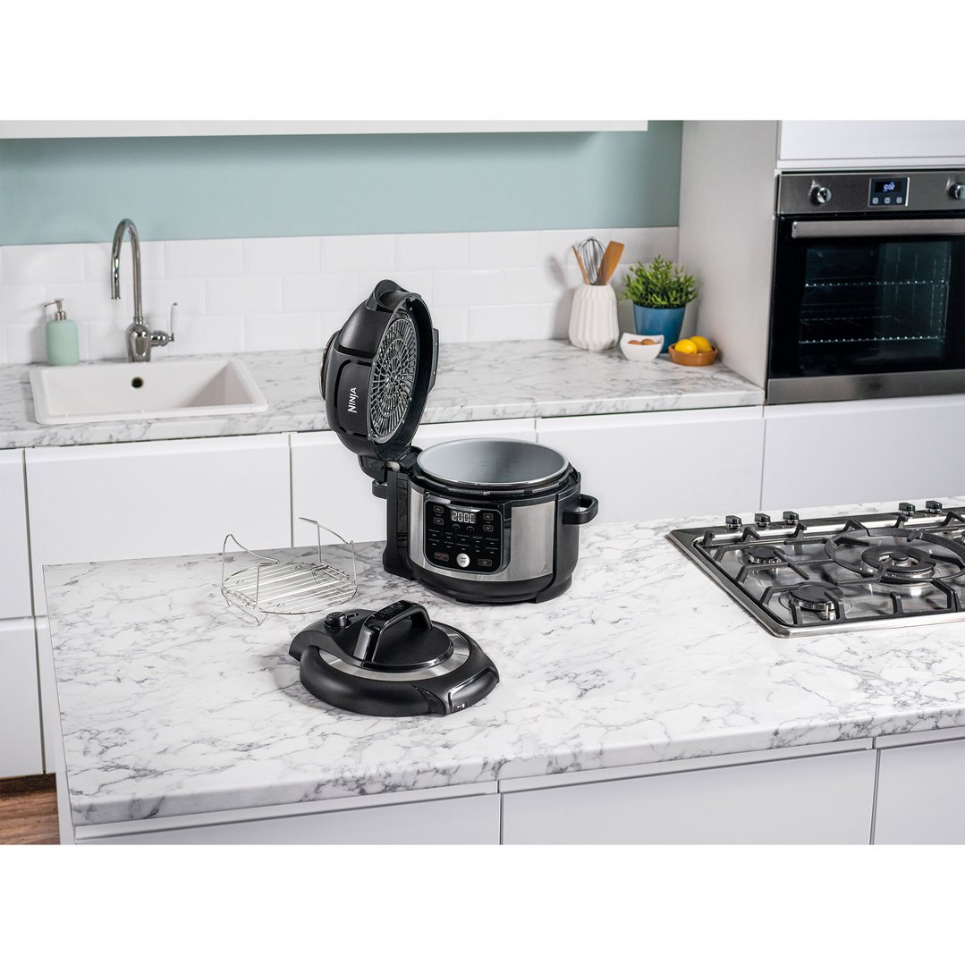 Ninja Foodi multi cooker with lid open on a kitchen counter