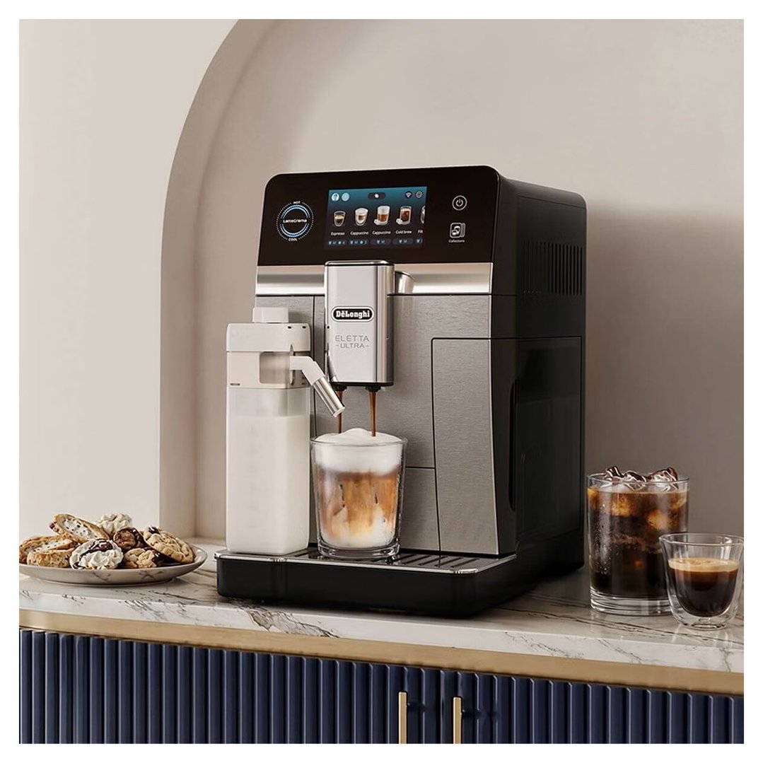 DeLonghi coffee machine dispensing coffee into a glass on a kitchen counter