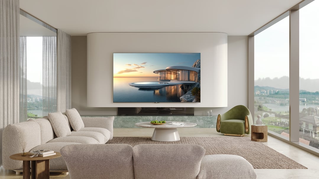 A TCL TV displaying a scenic image in a modern living room