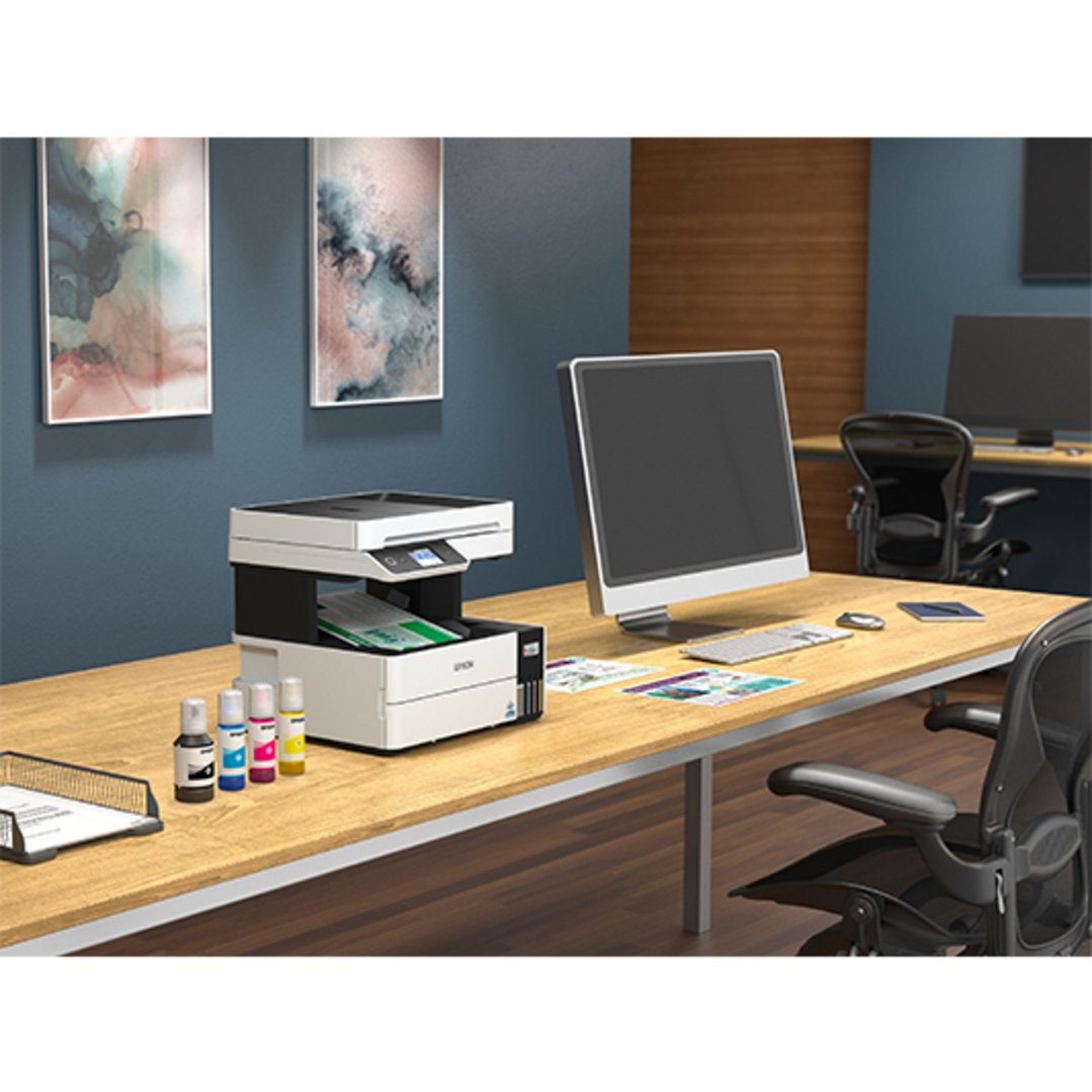 Epson EcoTank Pro multi-function printer on a wooden desk in an office setting