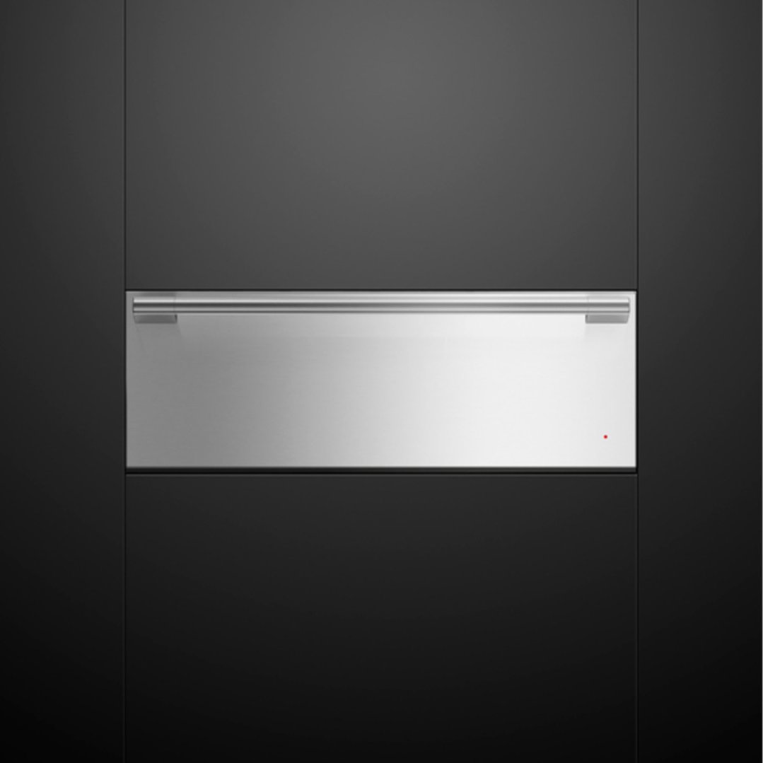 Stainless steel warming drawer built into dark cabinetry