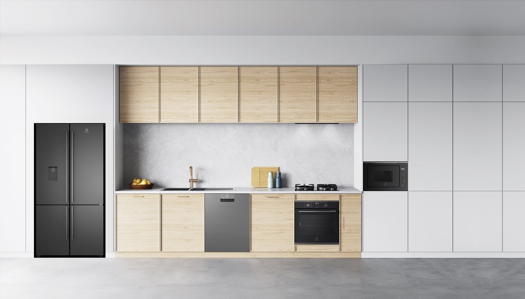 Modern kitchen with a black refrigerator, gas cooktop, oven, and microwave