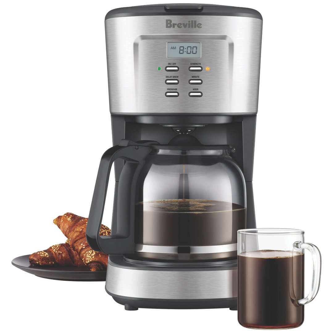 Breville Aroma Style Electronic coffee machine with coffee, croissants, and a mug
