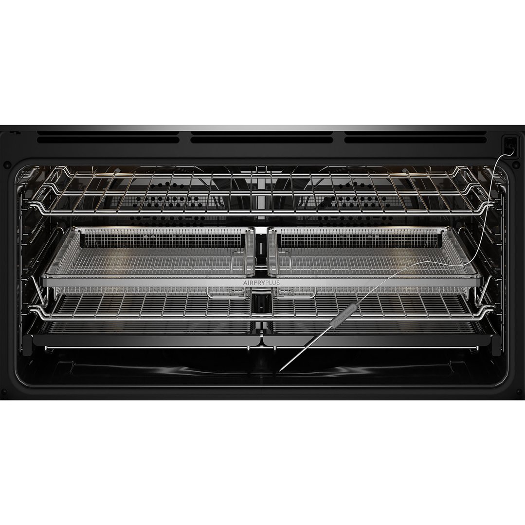 Inside view of an oven with two air fry baskets and a food sensor