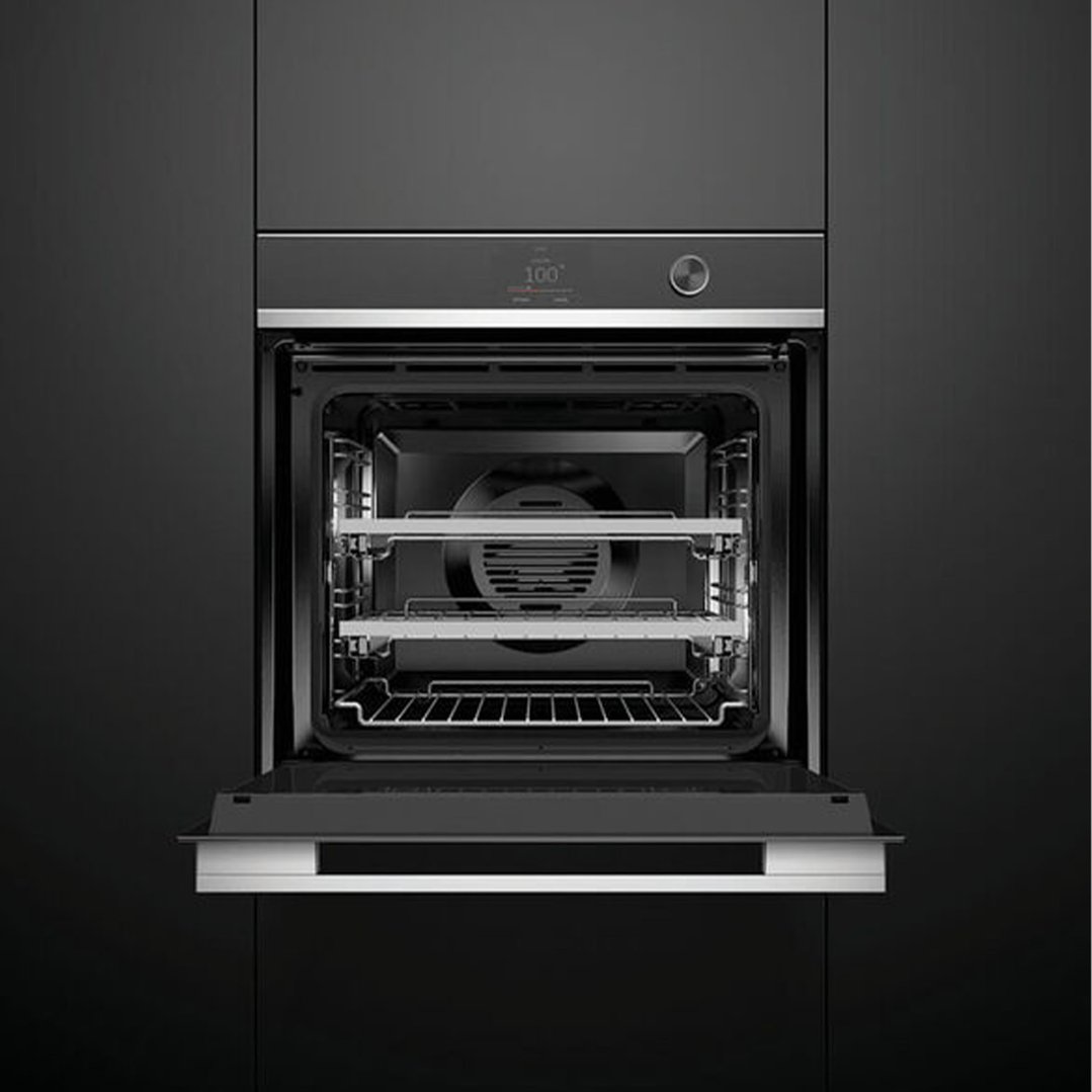 Black built-in compact combi-steam oven with door open, showing racks inside