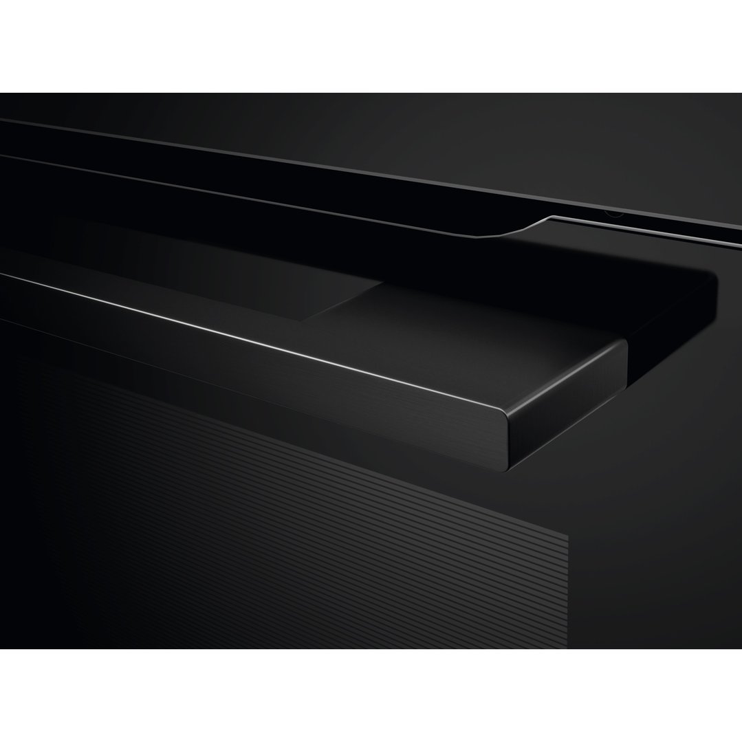 Close up of the black oven's handle and control panel