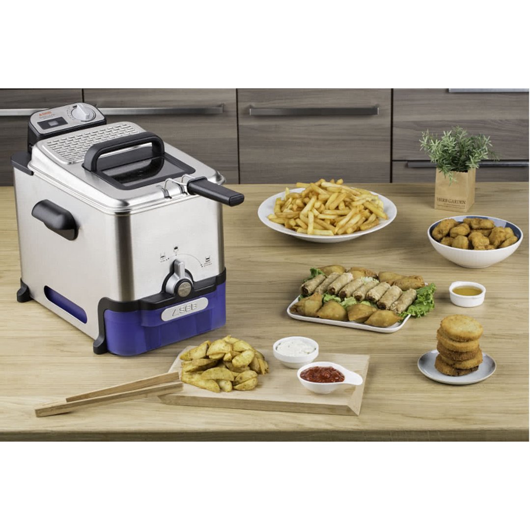 TEFAL Oleoclean Pro Deep Fryer on a wooden table with various fried foods