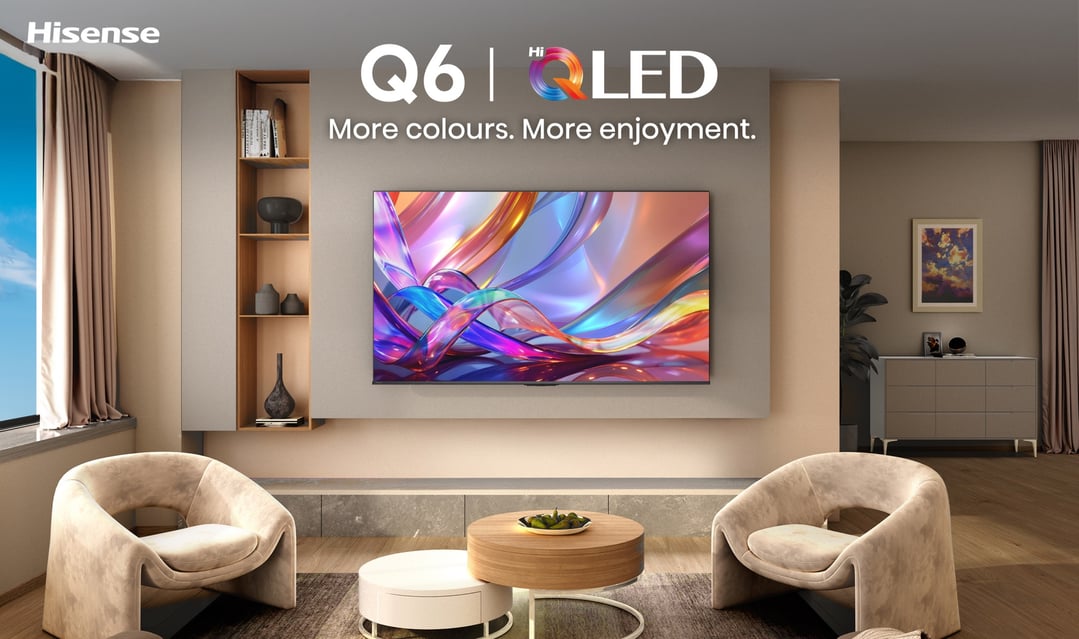 Hisense QLED TV in a modern living room with chairs and coffee tables