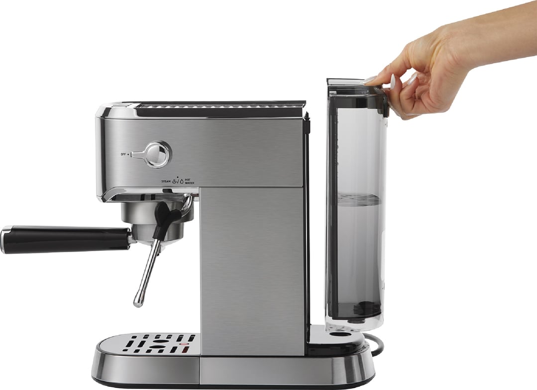 Hand removing the water tank from a stainless steel espresso machine