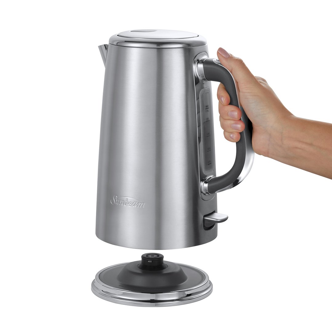 Hand holding a Sunbeam Arise 1.7L Kettle Stainless Steel, off its base