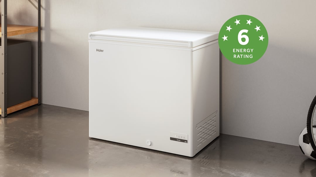 Haier chest freezer with a 6-star energy rating in a garage setting