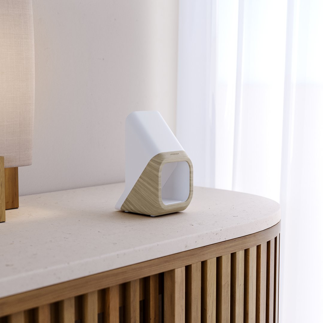 A NOVA 3-in-1 Fast Wireless Charging Station on a wooden and stone table