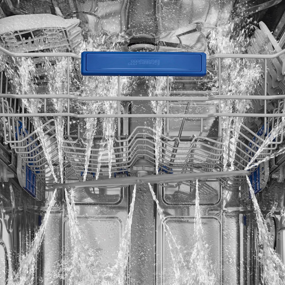 Inside a dishwasher with water spraying from the top and bottom racks