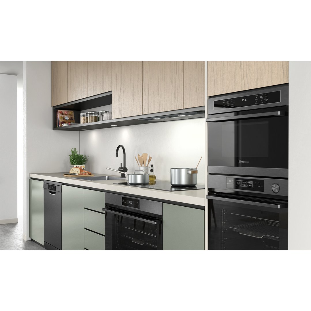 Dishwasher and other appliances in a modern kitchen with light wood cabinets