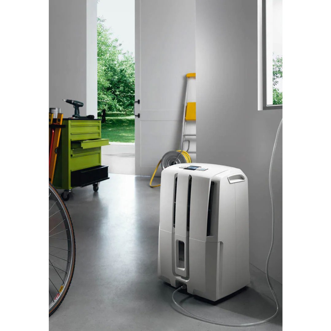 AriaDry Pump 30L Dehumidifier in a garage with tools and open door