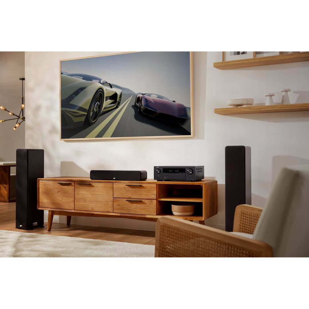 AV receiver and soundbar on a wooden console in a living room