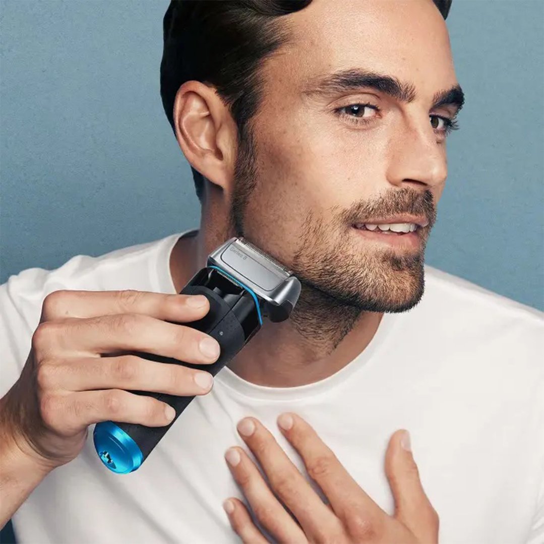 Man shaving his beard with a Braun Series 8 electric shaver