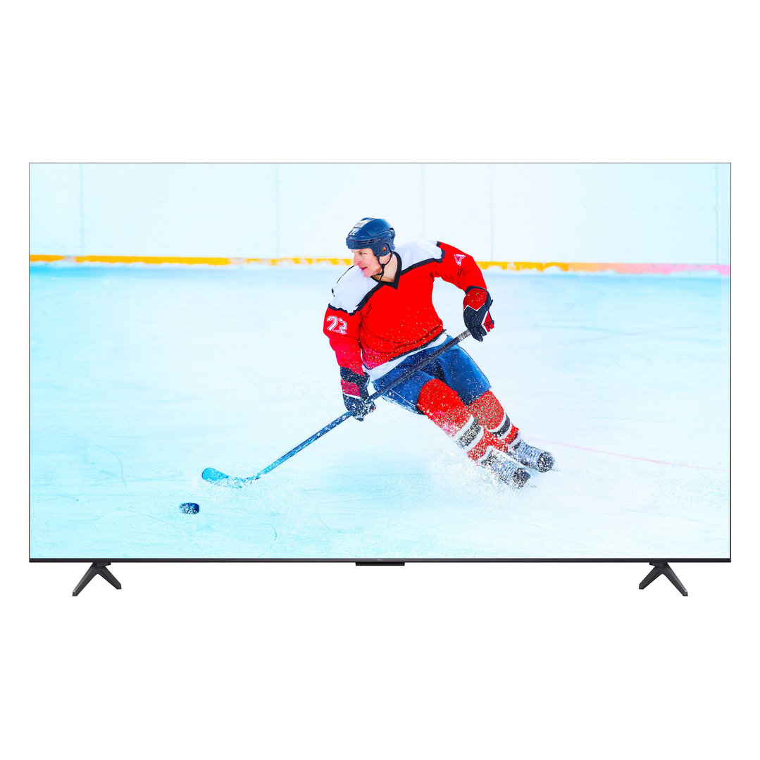 A TCL tv on a stand displaying a hockey player on an ice rink