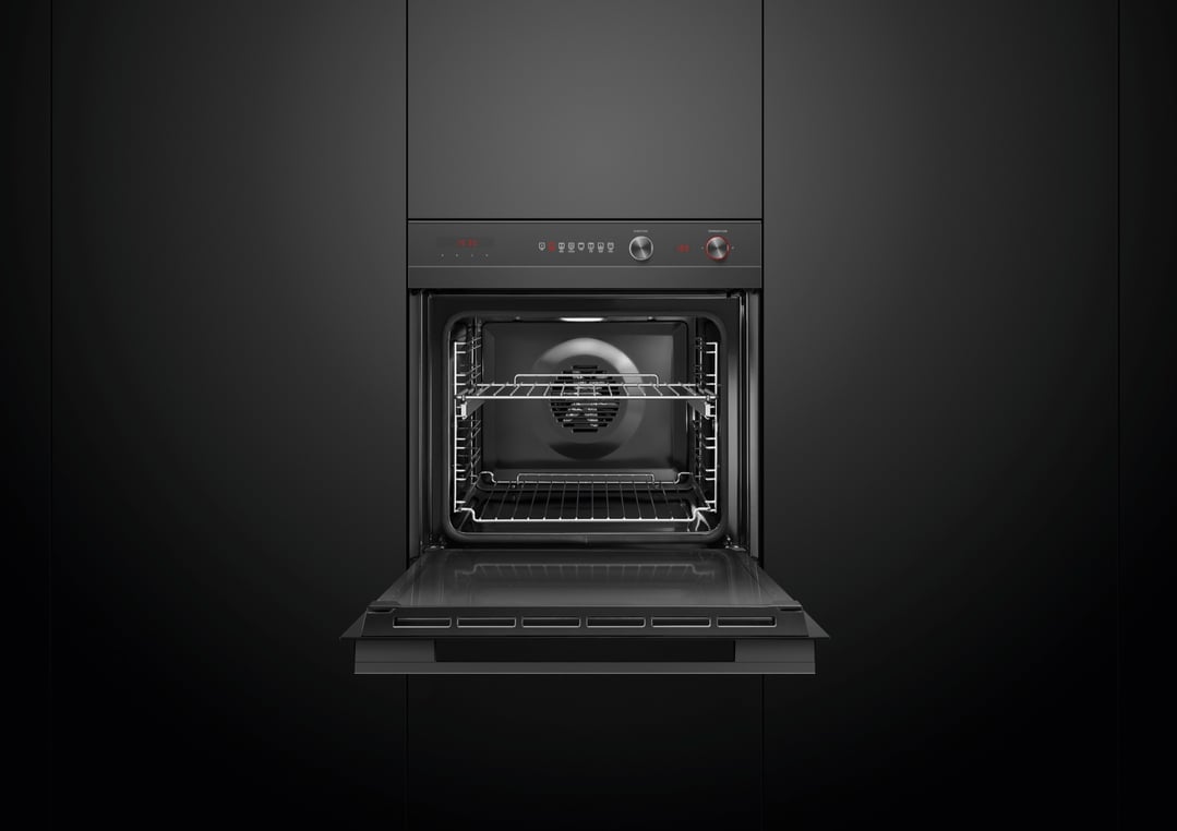 Built-in oven with the door open, showing the interior and control panel